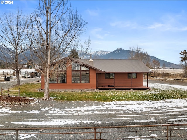 view of snowy exterior featuring a mountain view