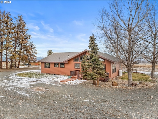 view of side of property with a wooden deck