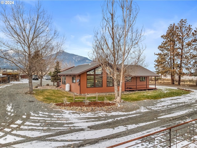 snow covered property with a mountain view