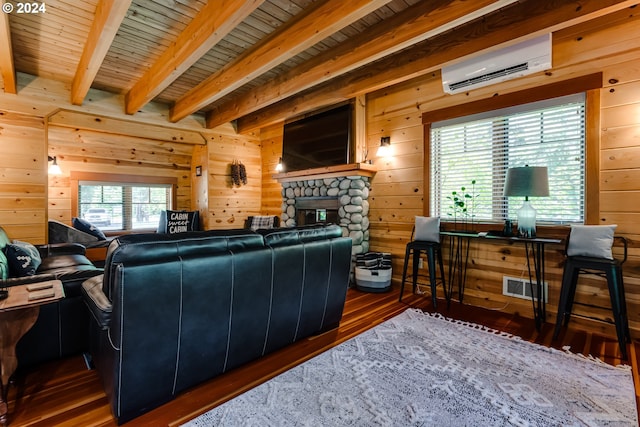 living room featuring beam ceiling, dark hardwood / wood-style floors, a wall mounted AC, and wood walls