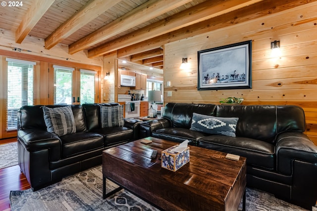 living room featuring wood walls, french doors, beamed ceiling, wood-type flooring, and wood ceiling