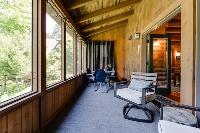 sunroom / solarium featuring vaulted ceiling with beams and wood ceiling