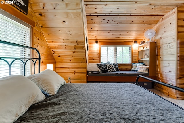 bedroom featuring carpet, wooden walls, wooden ceiling, and lofted ceiling