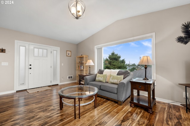 living room with hardwood / wood-style flooring and lofted ceiling