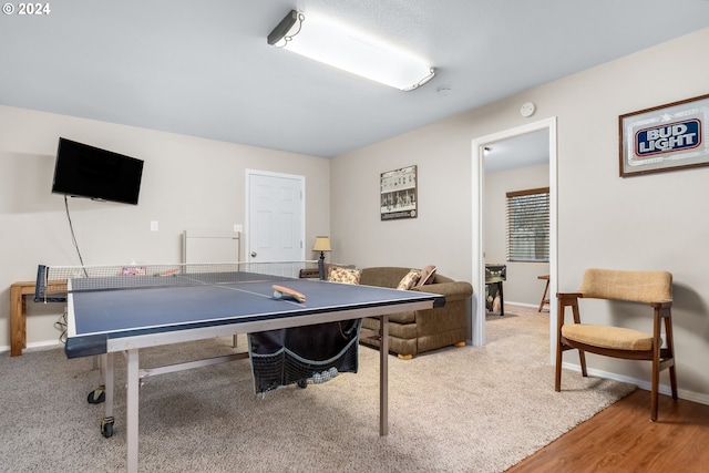 recreation room with hardwood / wood-style flooring