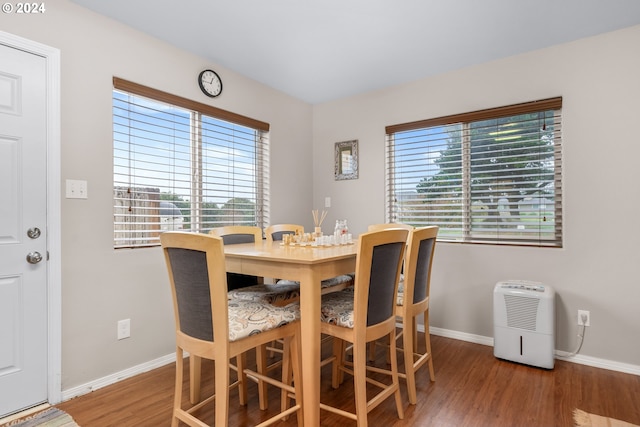 dining space with hardwood / wood-style flooring and a wealth of natural light