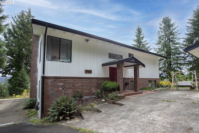 view of front of home with brick siding