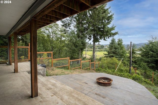 view of patio / terrace with a fire pit