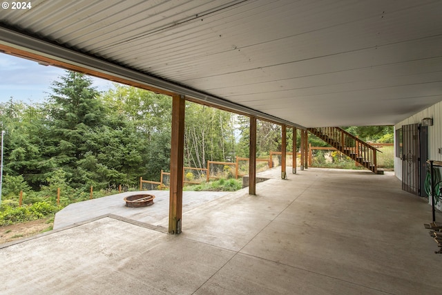 view of patio featuring a fire pit and stairs