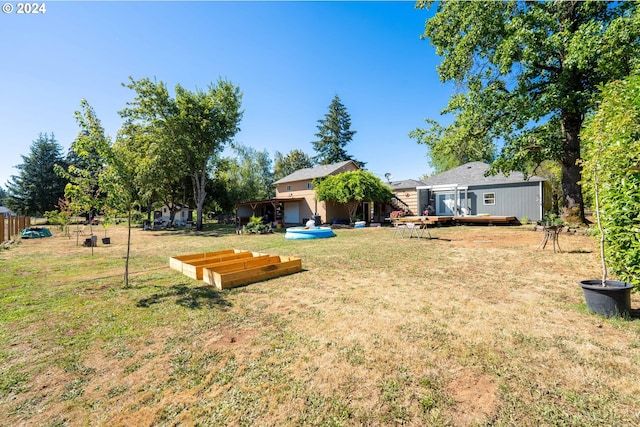 view of yard featuring a deck