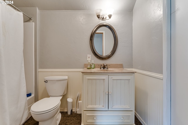 full bathroom with vanity, tile patterned floors, toilet, and shower / tub combo