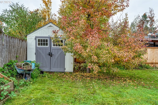 view of outbuilding with a lawn