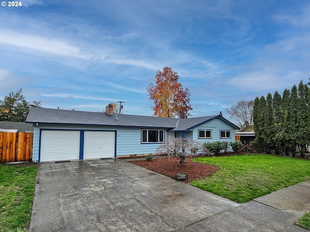 single story home with a garage and a front yard