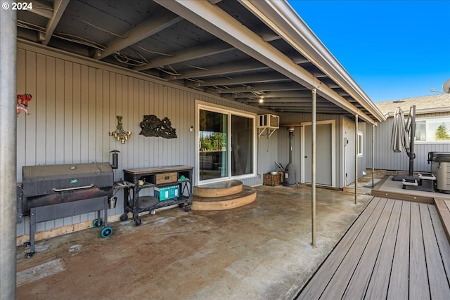 view of patio featuring a wall unit AC