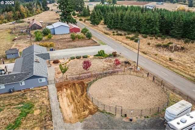 birds eye view of property with a rural view