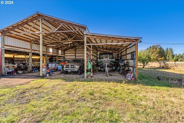 view of parking with a yard and a carport