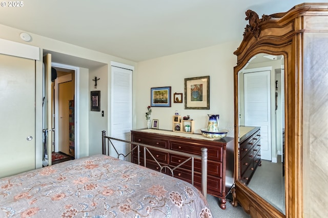 carpeted bedroom with a closet