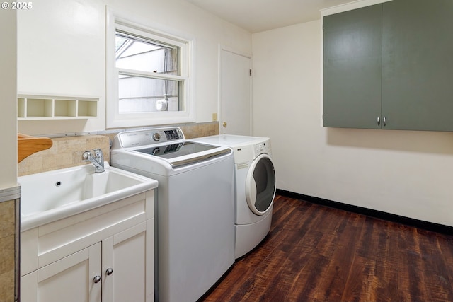 6312 SW Lesser Way, Portland, OR 97219 - clothes washing area with independent washer and dryer, dark wood-style floors, cabinet space, and baseboards