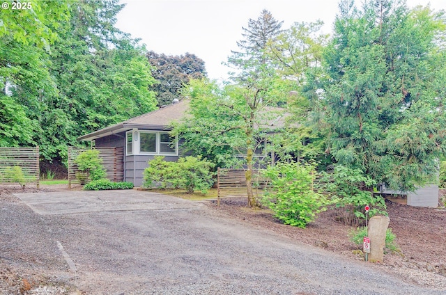 6312 SW Lesser Way, Portland, OR 97219 - view of front of home featuring fence and a shingled roof