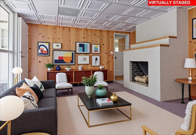 6312 SW Lesser Way, Portland, OR 97219 - carpeted living area with a brick fireplace, wood walls, and an ornate ceiling