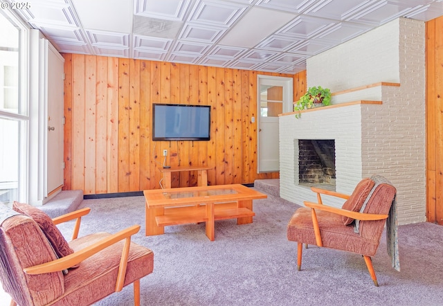 6312 SW Lesser Way, Portland, OR 97219 - carpeted living area with an ornate ceiling, wooden walls, and a brick fireplace