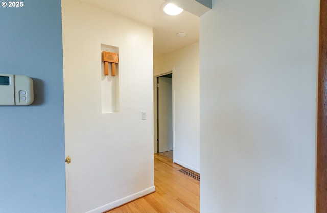 6312 SW Lesser Way, Portland, OR 97219 - hallway with light wood-style flooring and baseboards