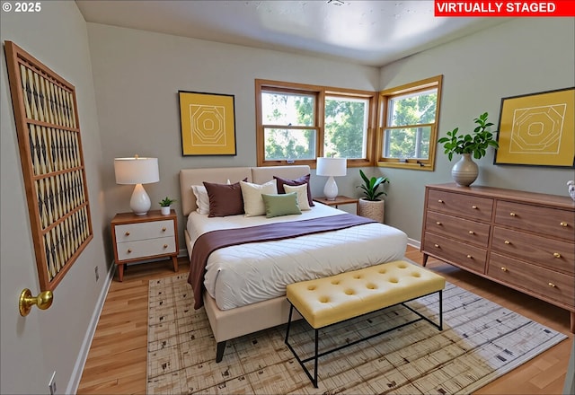 6312 SW Lesser Way, Portland, OR 97219 - bedroom featuring baseboards and light wood-style floors
