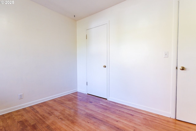 6312 SW Lesser Way, Portland, OR 97219 - unfurnished bedroom featuring light wood-style flooring and baseboards