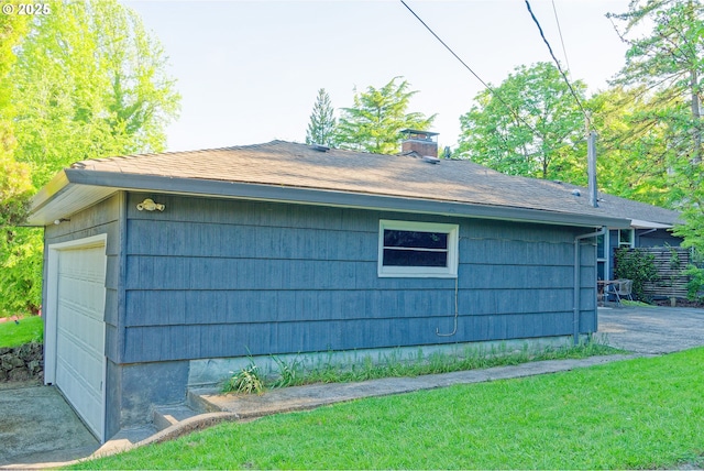 6312 SW Lesser Way, Portland, OR 97219 - view of property exterior with a chimney, a garage, and a shingled roof