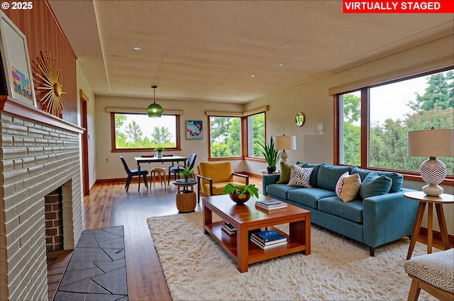 6312 SW Lesser Way, Portland, OR 97219 - living room with light wood finished floors, recessed lighting, baseboards, and a fireplace