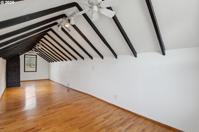 bonus room featuring ceiling fan, lofted ceiling with beams, and light hardwood / wood-style floors