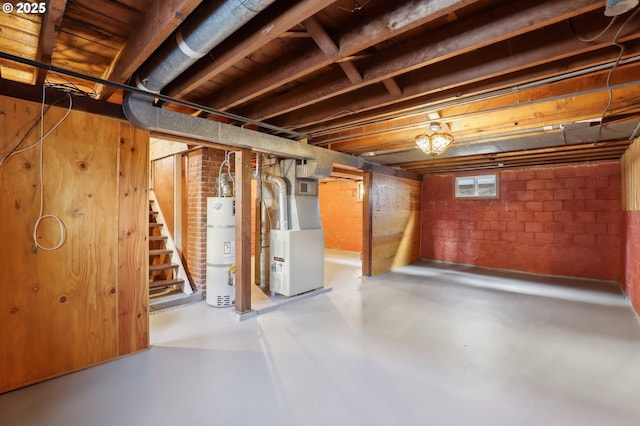 basement with heating unit and strapped water heater