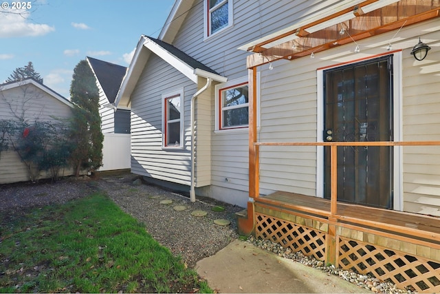 view of side of home with a wooden deck