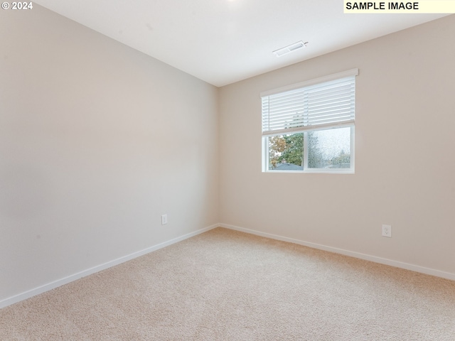 spare room with carpet flooring