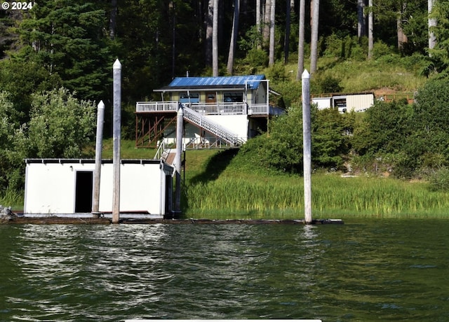 dock area with a deck with water view