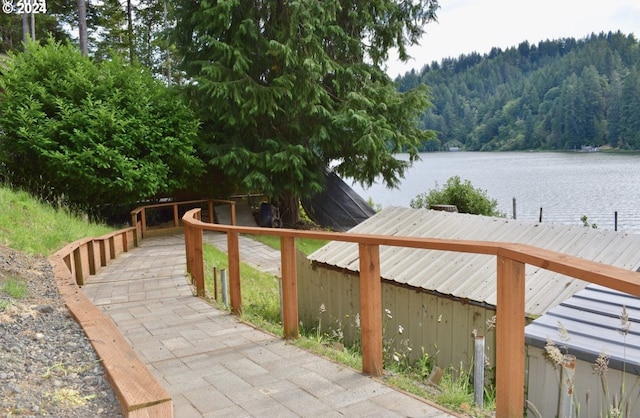 dock area featuring a water and mountain view