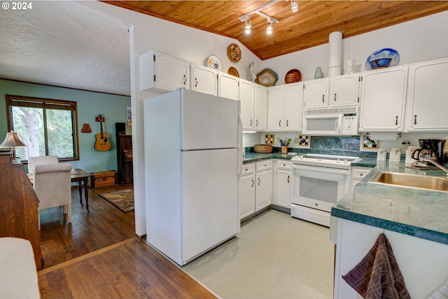 kitchen with white appliances, white cabinets, lofted ceiling, sink, and wooden ceiling