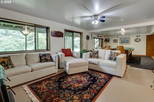 living room featuring ceiling fan, billiards, and a healthy amount of sunlight