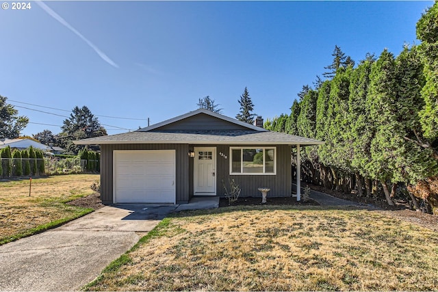 ranch-style house with a front lawn and a garage