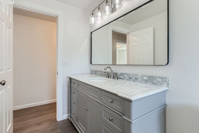 bathroom with vanity and hardwood / wood-style flooring