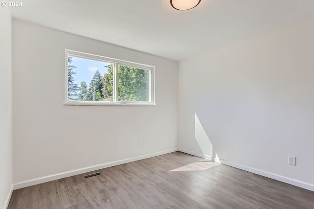 unfurnished room featuring light hardwood / wood-style flooring