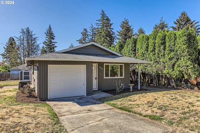 ranch-style house with a front yard, a garage, and cooling unit