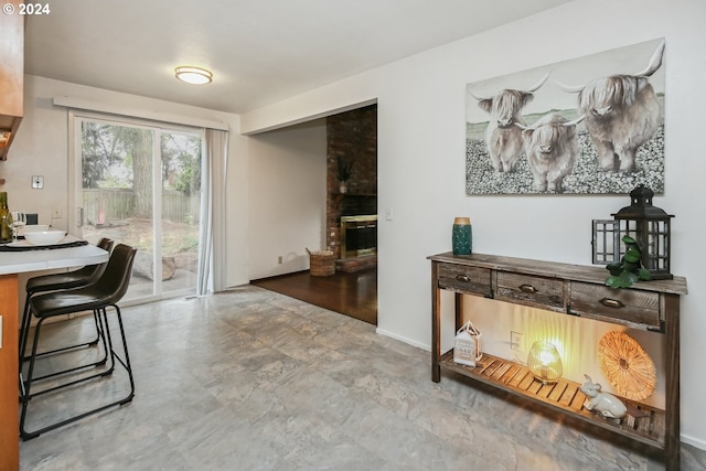 interior space featuring a brick fireplace