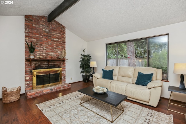 living room with a textured ceiling, a fireplace, lofted ceiling with beams, and dark hardwood / wood-style floors