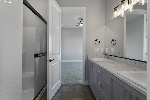 bathroom with ceiling fan and vanity