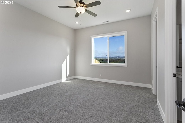 spare room with carpet flooring and ceiling fan