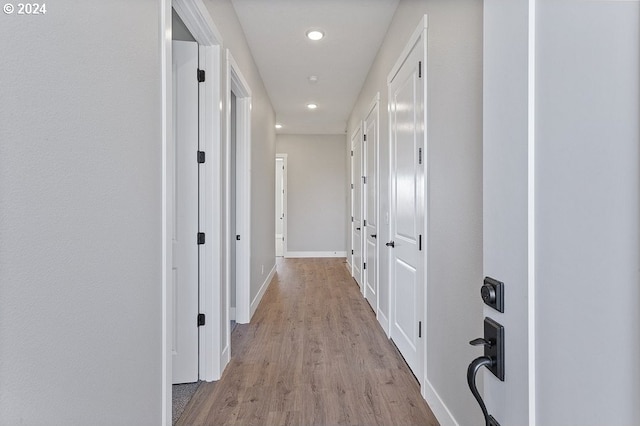 hall with light wood-type flooring