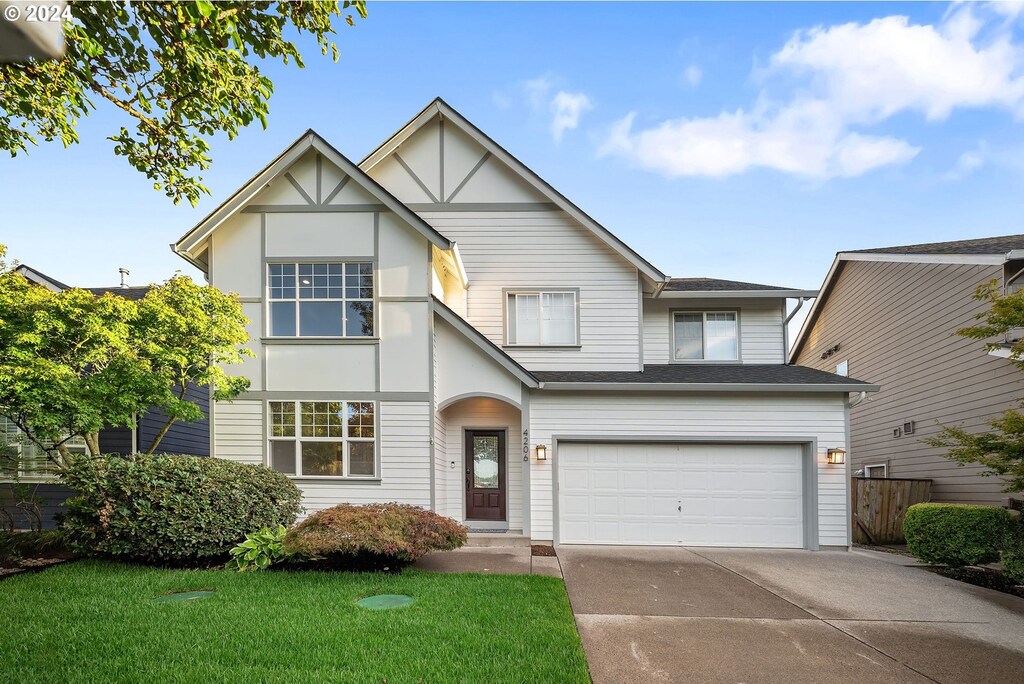 4206 NW 12th Ave, Camas, WA 98607 - view of front facade with a garage and a front yard
