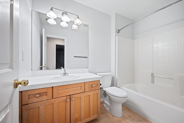 full bathroom with tile patterned flooring, bathing tub / shower combination, vanity, and toilet