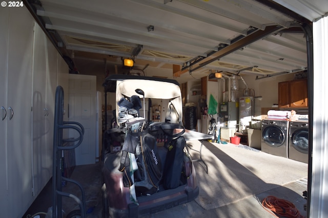 garage with water heater and washing machine and dryer